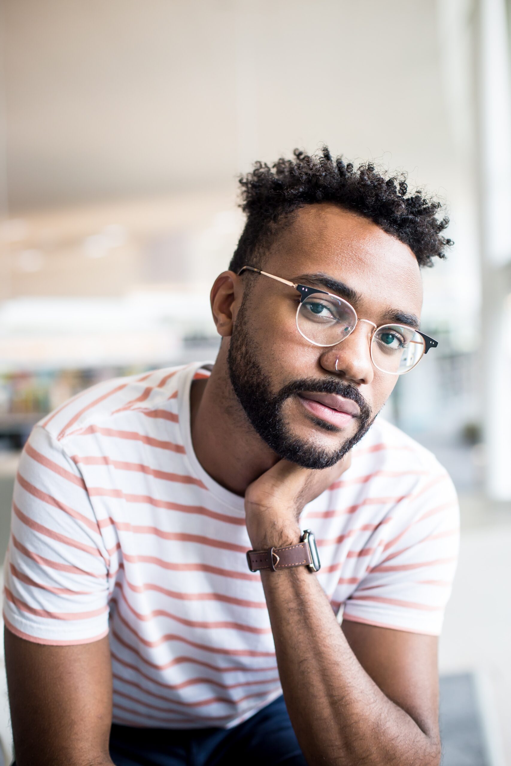 Black man leaning on elbow